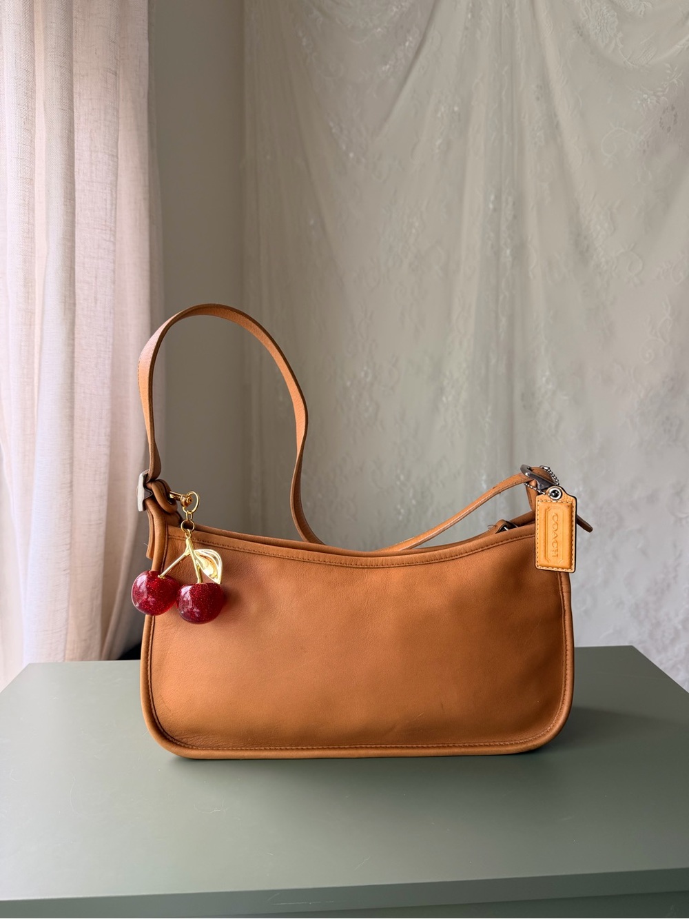 Coach Saddlebag Shoulder Bag in Caramel Brown with Red Cherry Charm